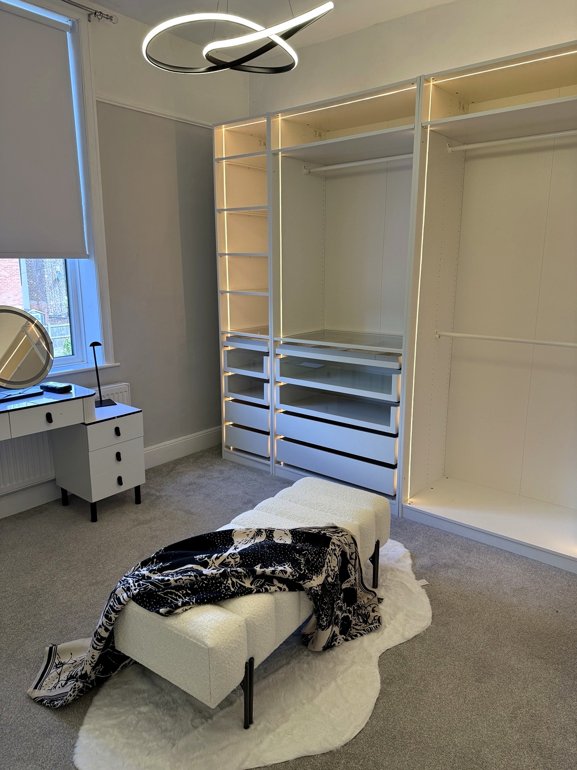 Bespoke illuminated wardrobe and dressing area